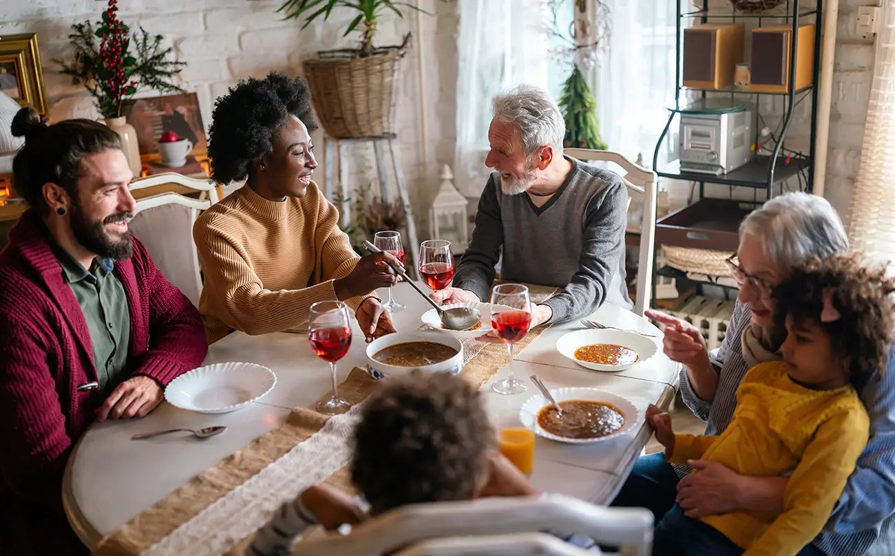Family members of different generations gathered around a dining table