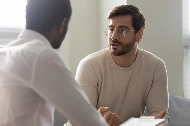 Two people discussing a case together
