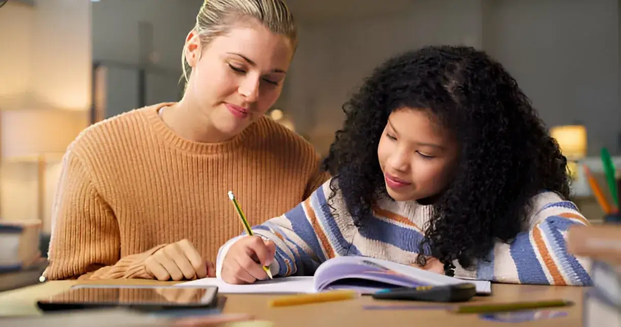 foster mom sitting with foster daughter 