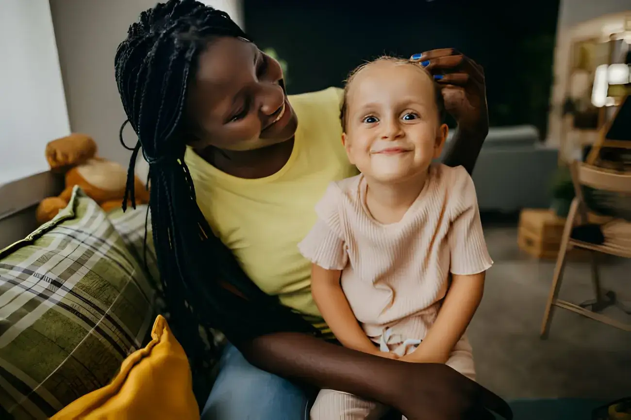 Foster mom and foster daughter posing playfully for portrait smiling and being silly