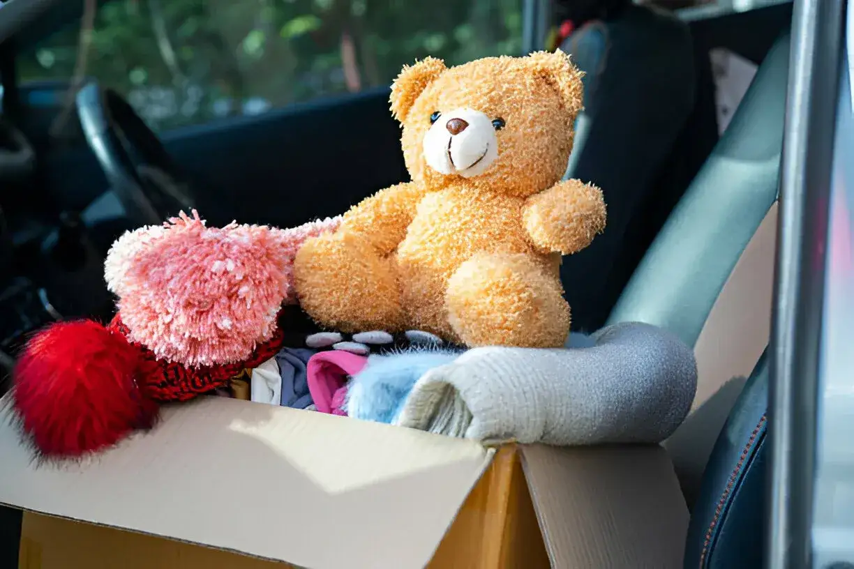 Teddy bear sitting in the car 